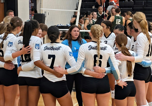 SCC Volleyball huddles during a game