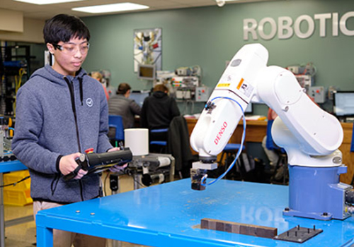 Prospective student in the robotics lab. 