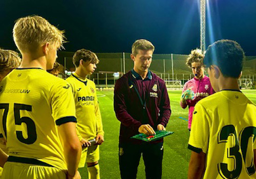 Eli Brown coaching soccer players