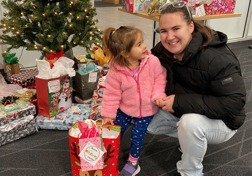 Chelsea, an SCC student, and her daughter at the Giving Tree