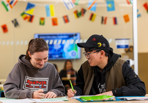 Two students studying on the Lincoln Campus. 