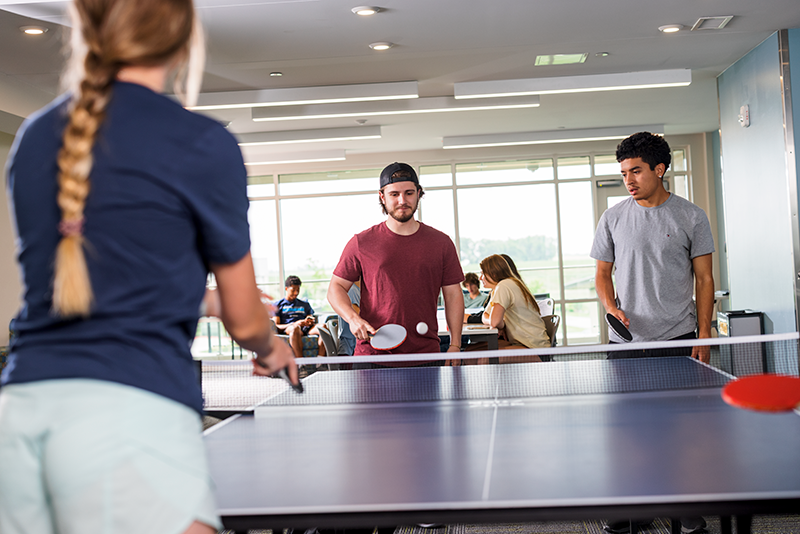 Students playing ping pong